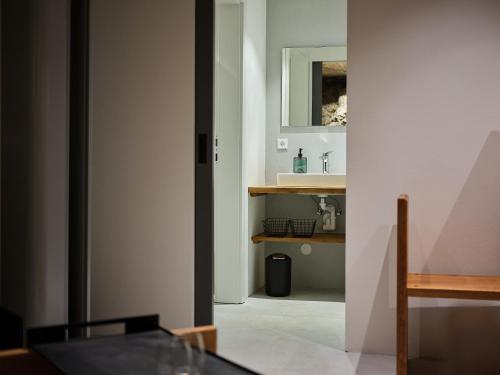 a kitchen with a table and a sink in a room at Haus Fünf mit 2 Apartments und Studio-Loft mit Terrasse in Melk