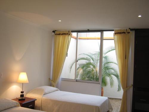 En eller flere senge i et værelse på Hotel Sol Dorado