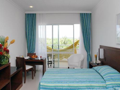 מיטה או מיטות בחדר ב-Bahia Plaza Hotel