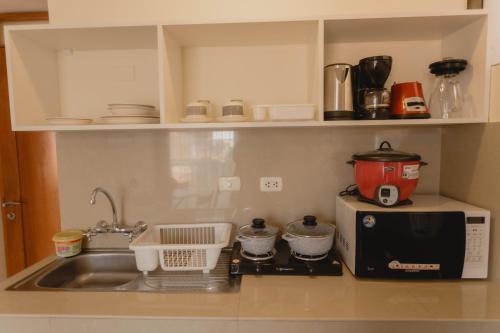 Η κουζίνα ή μικρή κουζίνα στο Quechua ApartHotel