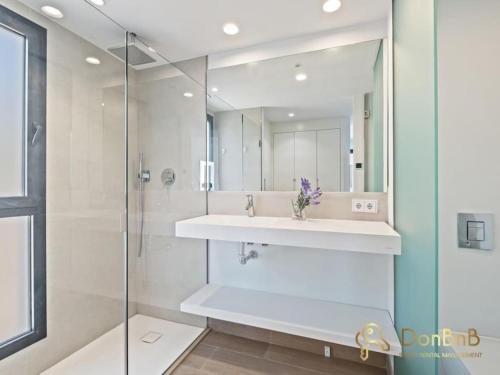 a bathroom with a sink and a mirror at Luxury flat in Higuerón West in Fuengirola