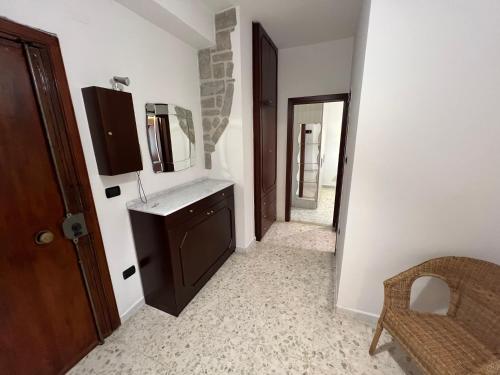 a bathroom with a sink and a mirror on the wall at Sweet Home Capodimonte in Naples