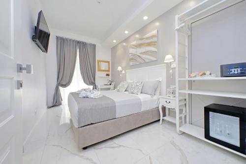 Ένα ή περισσότερα κρεβάτια σε δωμάτιο στο Roman Holiday Charming