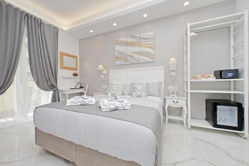 Ένα ή περισσότερα κρεβάτια σε δωμάτιο στο Roman Holiday Charming