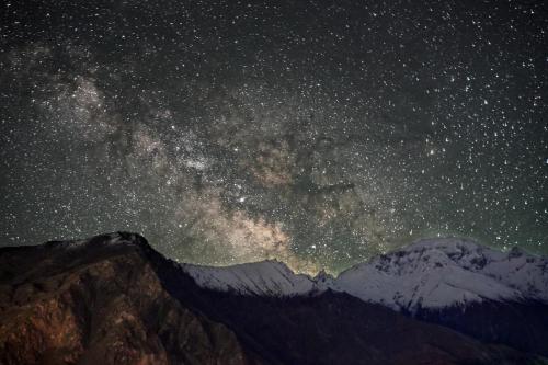 a starry night with the milky way over the mountains at Ambiance Resort Hunza in Hunza