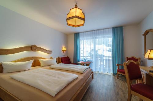 Postel nebo postele na pokoji v ubytování Parkhotel Sonnenhof