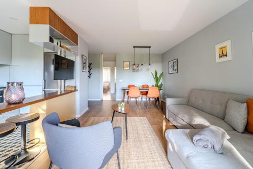 a living room with a couch and a table at Norton Matos - T2 in the heart of Braga by House and People in Braga