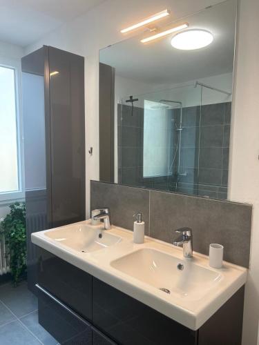 a bathroom with a sink and a large mirror at Cochemer Arkaden in Cochem