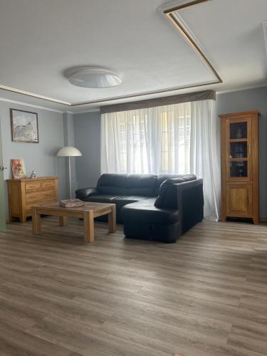 a living room with a couch and a table at Cochemer Arkaden in Cochem