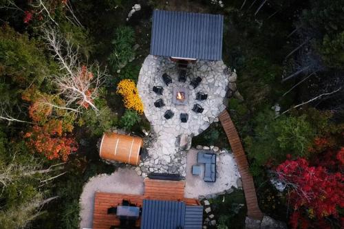 an overhead view of a house with a garden at ONNEA - Magical Chalet with Stunning Views, Sauna & Hot Tub in Petite-Rivière-Saint-François