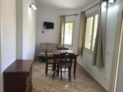 a room with a table and chairs and a couch at Appartamenti Pagni in Casa Morcone