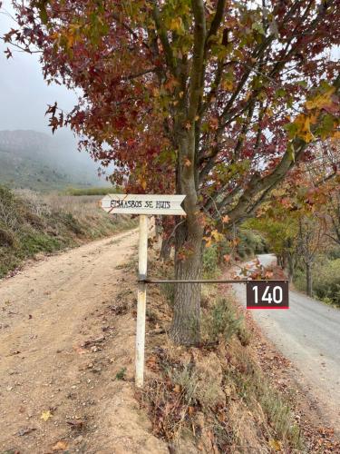 a street sign on the side of a dirt road at Fisaasbos in Tulbagh