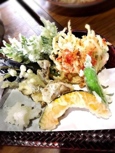 a plate of food on a table with food at 4BR only 1 stop away from Nikko attractions in Nikko