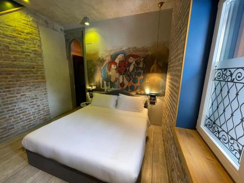 Кровать или кровати в номере Meri Boutique Hotel