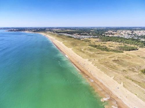 an aerial view of a beach and the ocean at Maison de pêcheur au calme in Brétignolles-sur-Mer