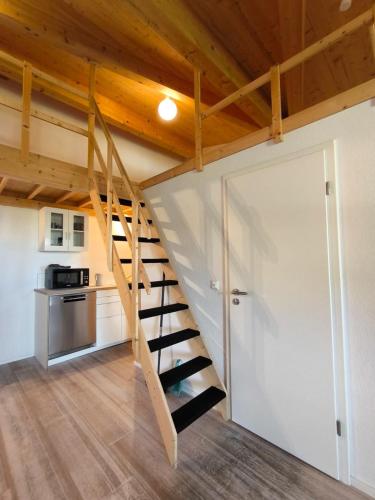 a staircase in a tiny house at Holzgebäude in Ebersbach an der Fils