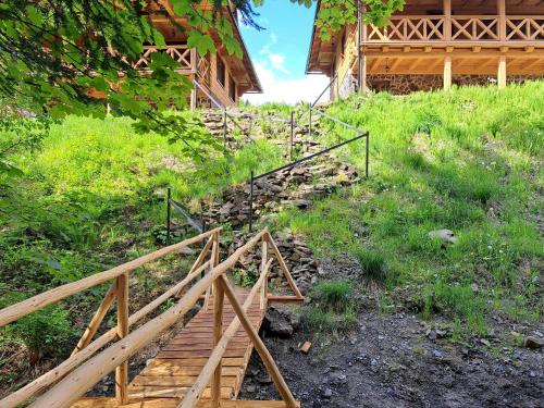 a wooden staircase leading up to a house at Drevenice Kaskády Oščadnica Veľká Rača in Oščadnica