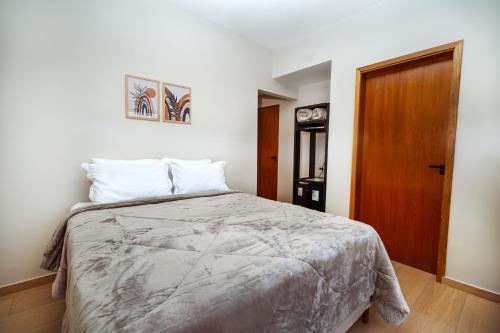 Ein Bett oder Betten in einem Zimmer der Unterkunft Pousada Canto da Montanha