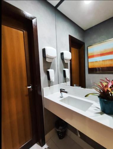 a bathroom with a sink and a mirror at Hotel Pepita Palace in Sinop