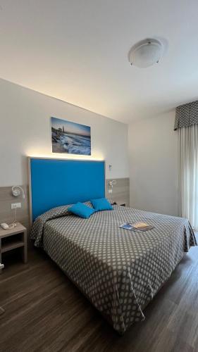 Ένα ή περισσότερα κρεβάτια σε δωμάτιο στο Hotel Le Star