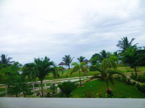 a view from the balcony of a resort with palm trees at Franswa Inn in El Nido