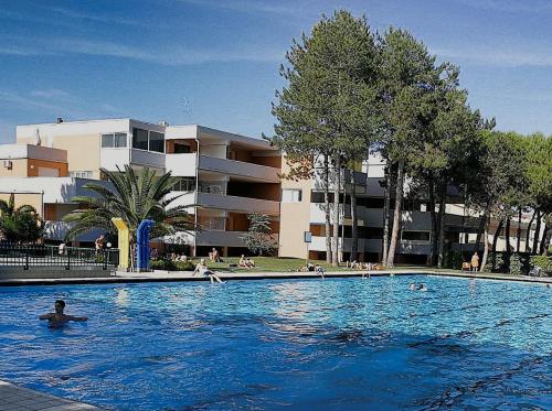 a large swimming pool in front of a building at RESIDENCE SOLARIUM, CORMOR 33 in Bibione