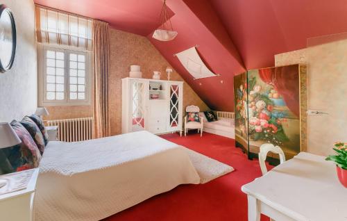 a bedroom with a white bed in a red room at Awesome Home In Lencloître in Lencloître