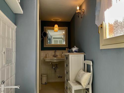 a bathroom with a sink and a mirror at Villa Diomira in Cannobio