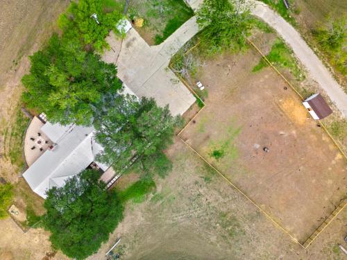 an overhead view of a yard with trees and a building at Farm Retreat with Jacuzzi, Fire Pit, Mini Goats, Mini Ponies and Mini Cows in San Marcos