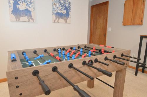 a large wooden box filled with different weapons at Bobcat 22 -- Hot Tub, Game Room, Wifi, Fire Pit, Pool Access, Fireplace, Grill, Screen Porch, Hiking, Deck, King Bed, Pet Friendly in Berkeley Springs