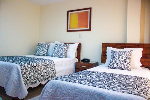 San Juan Del Lago tesisinde bir odada yatak veya yataklar