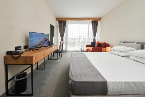 Телевизор и/или развлекательный центр в Hotel Bavaro