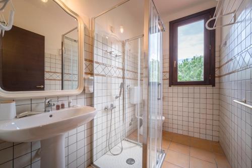 a bathroom with a sink and a shower at Agrolea in Terme Vigliatore