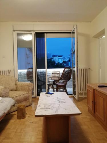 a living room with a couch and a table at Hidden Gem in Dušanovac (historical)