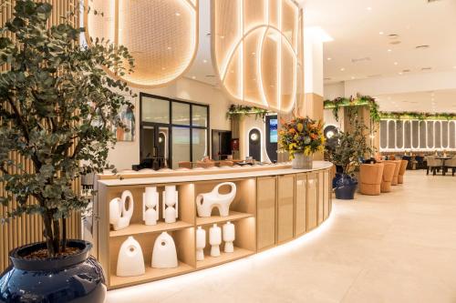 a store with vases on display in a mall at Ilunion Les Corts Spa in Barcelona