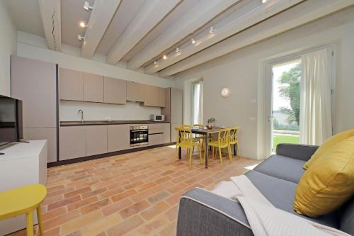 a living room with a couch and a table at Agriturismo Biancarda in Massignano