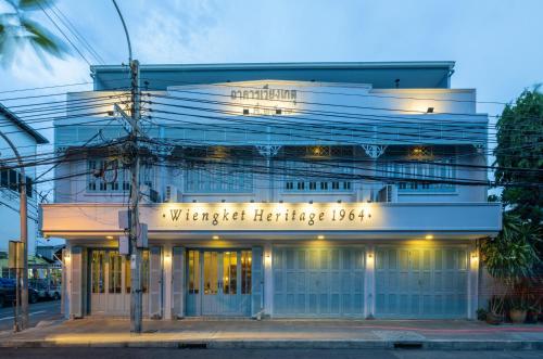 a building with a sign on the front of it at Wiengket Heritage 1964 in Bangkok