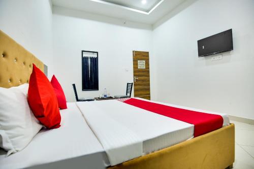 Krevet ili kreveti u jedinici u okviru objekta Flagship Hotel Cozy Comfort