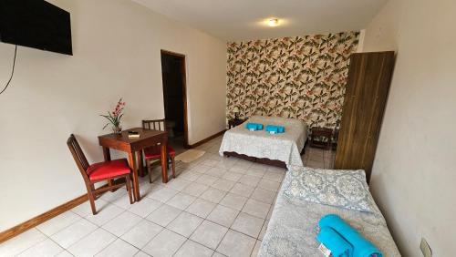 a living room with a couch and a table at Iguazu Hojas Verdes in Puerto Iguazú