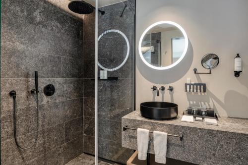 a bathroom with a shower and a sink at Château de Vignée in Rochefort