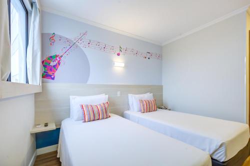 Cama o camas de una habitación en Transamerica Fit Villa Lobos