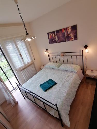 a bedroom with a large bed in a room at Flavia in Cividale del Friuli