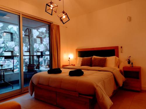 Säng eller sängar i ett rum på PILTRI de Bs As Un departamento de ensueños para disfrutar la ciudad