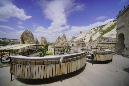 a building with a view of the rock formations at Vezir Cave Suites in Goreme
