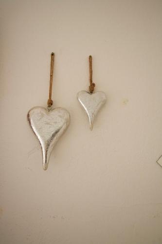 two heart shaped hooks hanging on a wall at Gjaid-Alm 1739m am Dachstein-Only Accessible by Cable Car in Obertraun