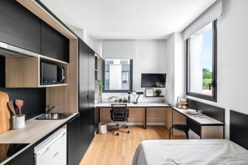 Kuchyň nebo kuchyňský kout v ubytování Home and CoLiving Pamplona