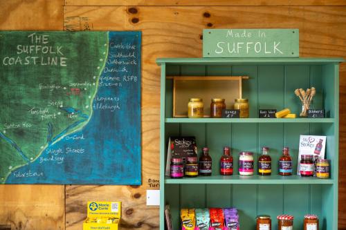 a shelf filled with lots of different types of food at Skylark - Sweffling Hall in Rendham