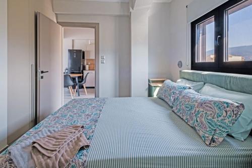 a bedroom with a large bed with a window at Avras experience in Faraí