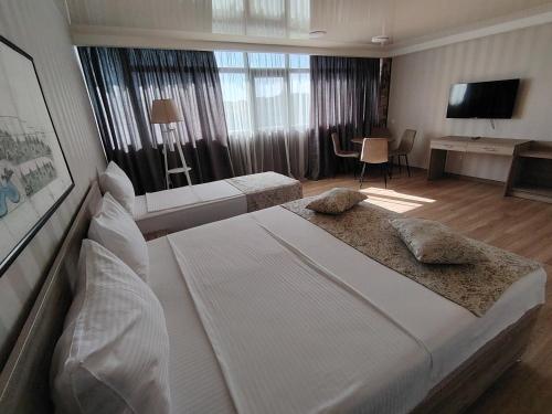 Postel nebo postele na pokoji v ubytování Vita Gardenia Hotel Tskaltubo