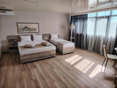 Postel nebo postele na pokoji v ubytování Vita Gardenia Hotel Tskaltubo
